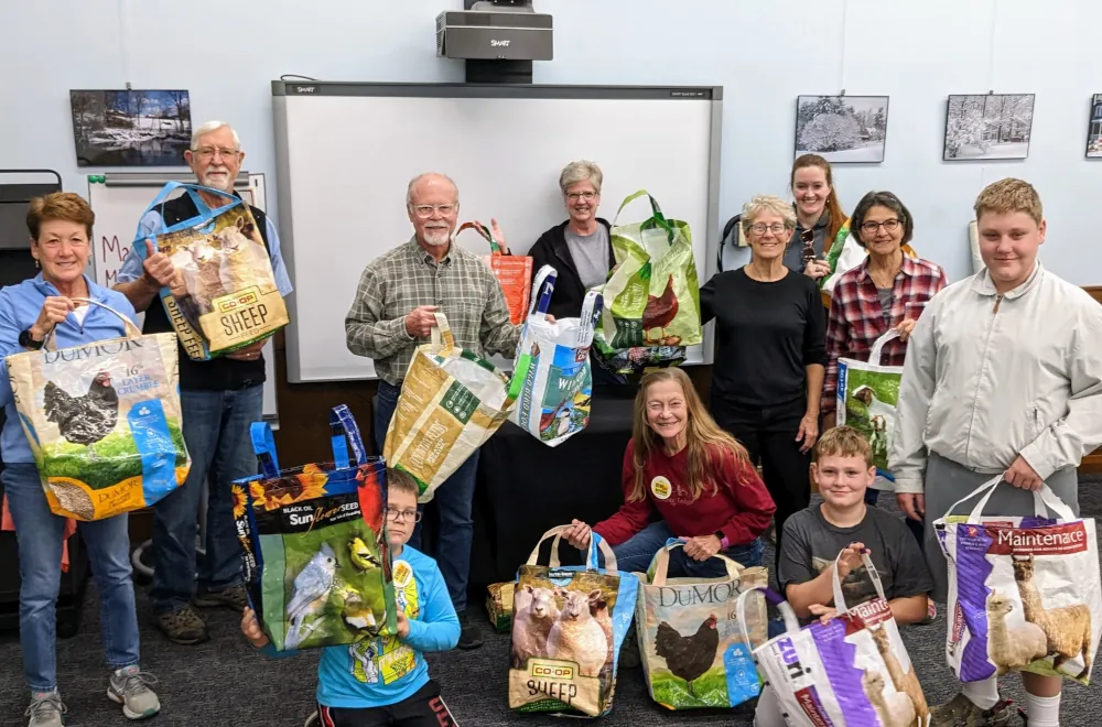 photo of people holding reusable bags